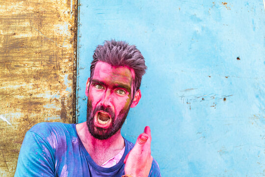 Spontaneous traveler shouting during Holi festival