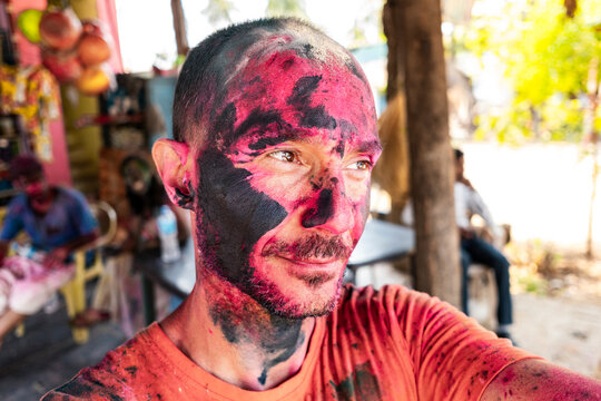 Mindful traveler embracing sacred Holi ritual