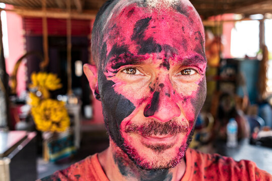 Introspective portrait with sacred Holi ash pigment
