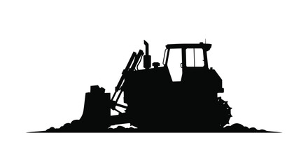 Black silhouette of a powerful bulldozer heavy construction machine pushing a pile of dirt with its front blade on a worksite.