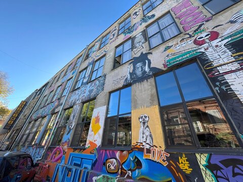 Colorful street art and industrial architecture at the famous Fabrika hostel and creative hub courtyard in Tbilisi, Georgia. November 2023.