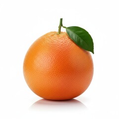 Ripe red grapefruit with a stem and green leaf on a reflective white surface under soft lighting