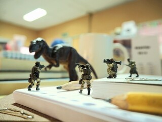 Mini toy of action figure with blurred background. Toy photography concept. © awstoys