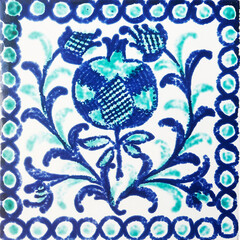 Detail of the traditional tiles from facade of old house. Decorative tiles.Valencian traditional tiles. Floral ornament.
