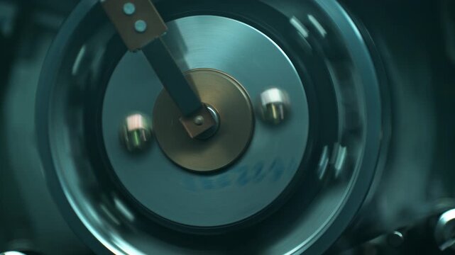 VHS Video Tape Wrapping Around the Rotating Head Drum of the VCR - Top View, Interrogation Room Mood