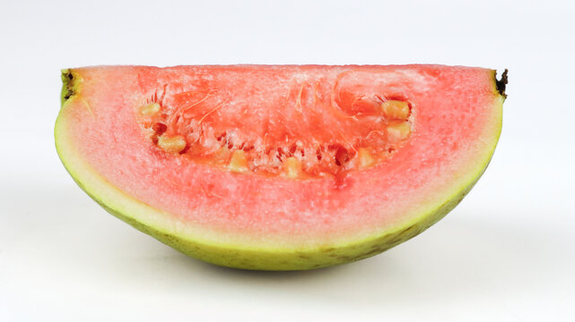 Fresh sliced red guava isolated on white background