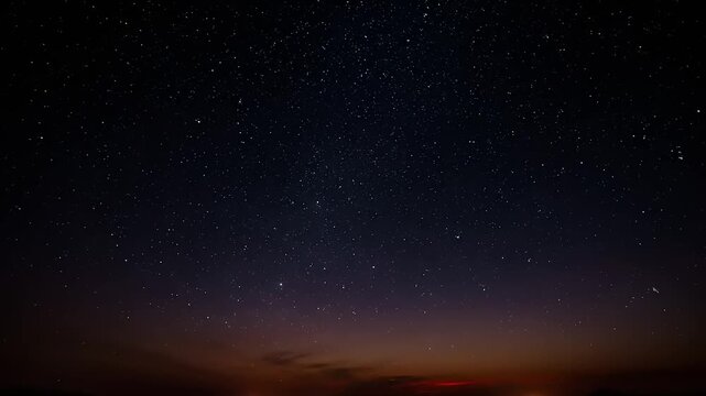 Vast night sky transition from vibrant sunset clouds with faint stars emerging to a rich, deep celestial expanse filled with countless twinkling constellations, symbolizing peace, wonder