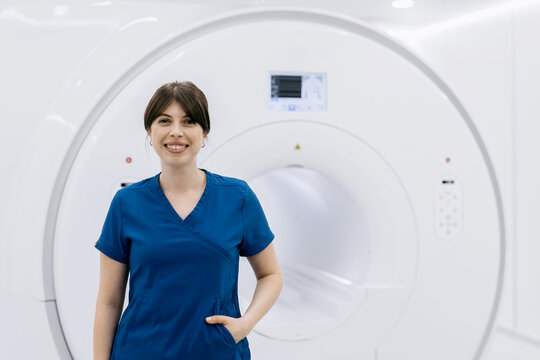 Medical specialist in radiology department with MRI equipment. Medical examination concept
