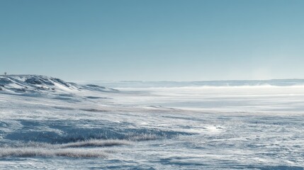 Obraz premium Snowy landscape scene under clear blue sky with open space for design