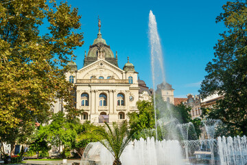 Kosice National Theater in baroque style with Singing Fountain on foreground, Main street, Kosice Old Town, Slovakia 