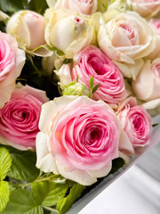 Elegant pink and white rose bouquet arrangement with fresh blooms closeup