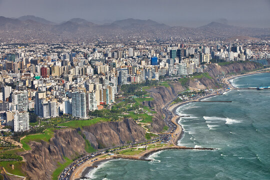 Aerial view of Miraflores and Costa Verde coastline in Lima, Peru, showcasing modern urban living along the Pacific Ocean with scenic cliffs, vibrant cityscape, and coastal landscapes. 