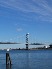 Fototapeta premium Benjamin Franklin Bridge over Delaware River in Philadelphia with clear blue sky