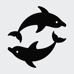 Fototapeta premium Two dolphins swimming together in playful black silhouette