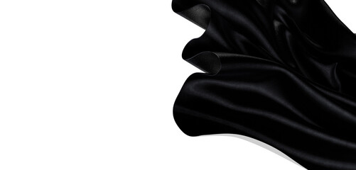 A close-up shot of luxurious black fabric gently flowing against a pristine white background. Captures texture and elega © vegefox.com