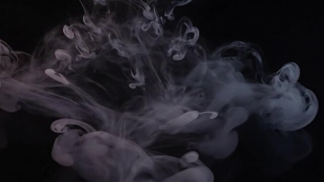 Macro Diffusion Detail Extreme close-up, almost macro, highlighting the fine swirling and diffusion of the smoke-like patterns within the liquid.