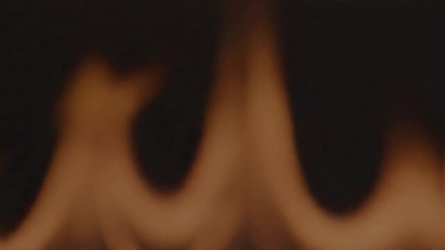 Firelight Monotone monotone firelight under soft backlight; clean background; stock-safe, car-free; no faces; no trademarks scene 1 Abstract cinematic angle