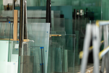 Stack of glass sheets stored in warehouse at glass factory