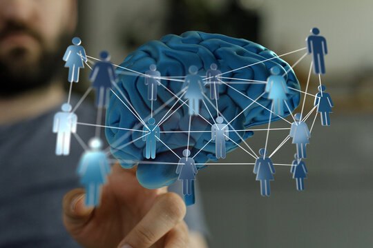 Concept of human connection, brain activity, and social networks illustrated by an artistic image of the brain and huma