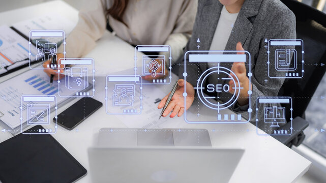 Professionals collaborate on SEO strategy analyzing website data with charts and virtual interface for digital marketing success and traffic growth SEO analysis strategy