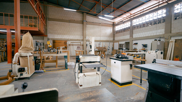 Woodworking factory workshop showing industrial machinery and tools for timber processing, production, and manufacture