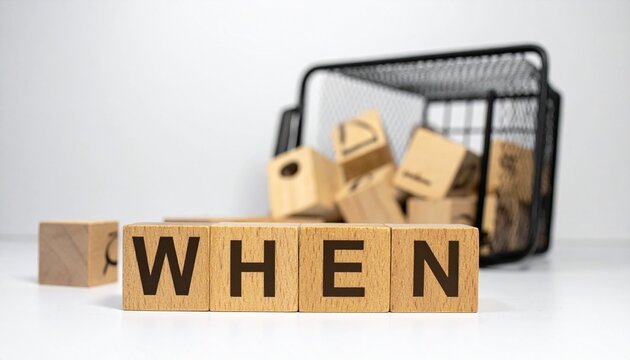 Wooden blocks spelling when with tipped basket and scattered blocks symbolizing inquiry reflection and disruption