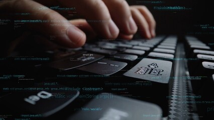 A focused close-up image showcases hands typing on a laptop keyboard, surrounded by flowing lines of code, emphasizing technology and programming in a digital workspace. Xenic