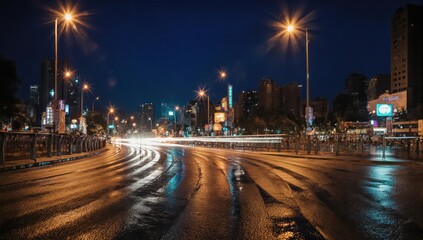 Fototapeta premium City street at night with streaks of car lights reflecting on wet road