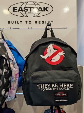 Rome, Italy - February 20, 2025, a series of Eastpak backpacks, an American brand specializing in bags, backpacks, travel items, and accessories, displayed for sale in a stationery shop.