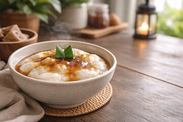 Traditional Indonesian Rice Porridge with Palm Sugar Syrup in Rustic Setting