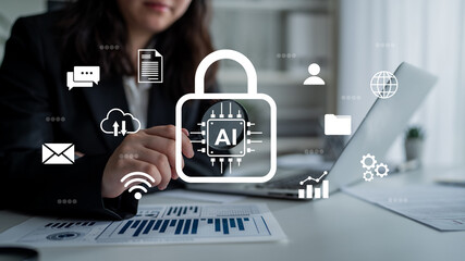 Fototapeta premium A business professional sits at a desk using a laptop, demonstrating artificial intelligence security features with overlay icons that represent data analytics and communication. Gantry