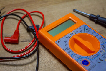 Digital multimeter with wires, tool for battery voltage checking