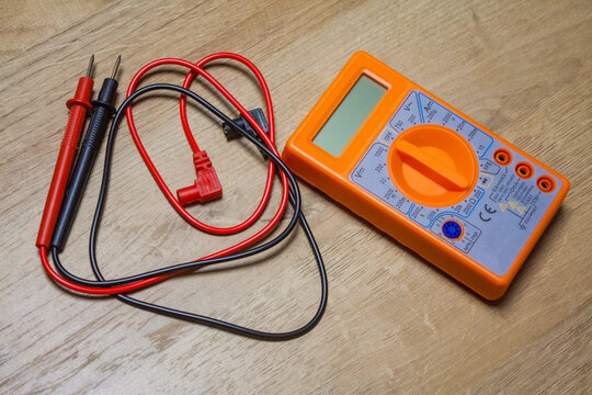 Digital multimeter with wires, tool for battery voltage checking