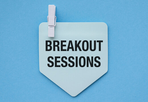 Breakout Session concept with sticky notes and pen on tan background