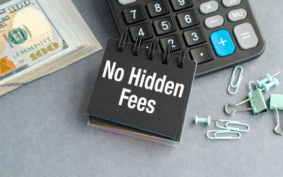 No Hidden Fees concept, black notepad with text, calculator and dollar bills.