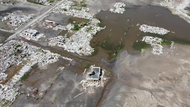 Aerial perspective of destroyed houses and streets in abandoned Epecuen