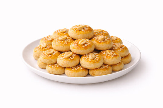 Indonesian Peanut Cookies Traditional Lebaran Snack Isolated on White. Classic homemade kue kacang with golden baked surface, ideal for bakery menu, food advertising, packaging, cookbook illustration.