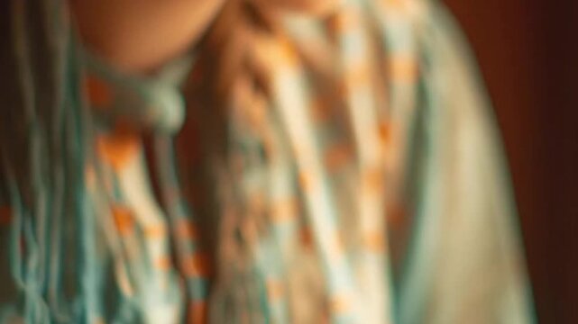 Close-up of a hand picking up a sticky date from a decorative plate, sweet food