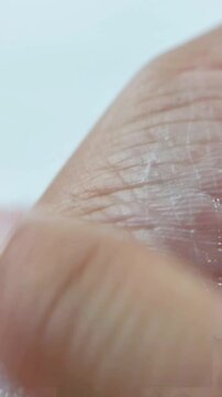 Beauty and skin health cream, smoothing or fading cream on the skin. Vertical close up shot. For feminine hygiene products.
