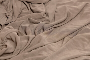 Neutral mocha textile mockup with blank envelope.