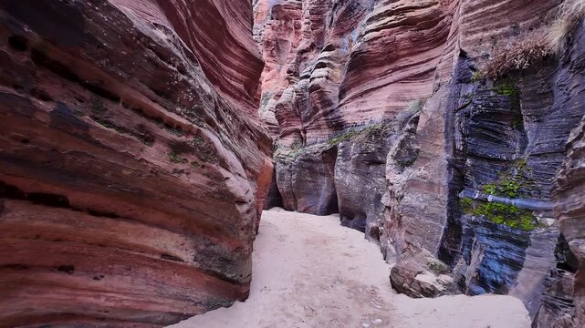 View of hiking through a slot canyon in Zion Utah in the desert.