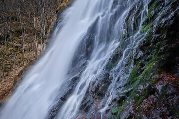 Fototapeta premium Close-up of Impressive, scenic, powerful Piljski waterfall on Stara planina (Balkan mountains) near Topli Do, long exposure blurred motion