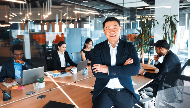 Confident Business Executive Leading Diverse Team in Office
