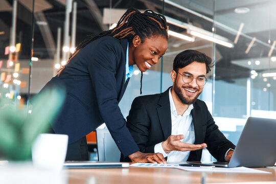 Diverse Business Team Collaborating in Modern Office Meeting