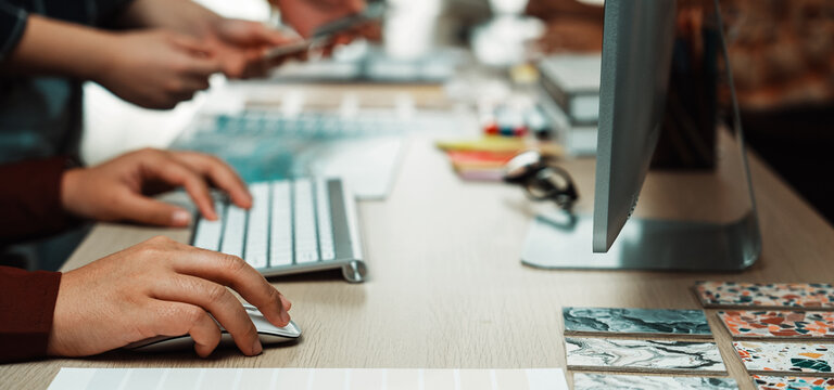 A dynamic scene showcasing diverse hands engaged in design work at a modern workspace, highlighting collaboration with digital tools, colorful swatches, and creative inspiration. SACTR