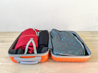 Suitcase open for travel preparing for journey