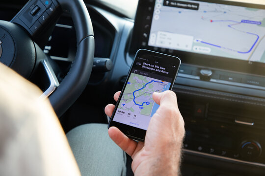 SICILY, ITALY - JUNE 2025: driver using google maps for navigation