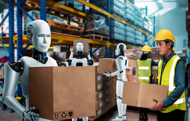 Innovative industry robot working in warehouse together with human worker . Concept of artificial...