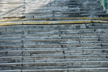 Worn stone steps leading up through sunshine and shadows