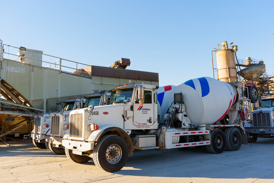 Perris, California - December 6, 2025: Concrete Mixer Trucks Lined Up at Cemex Batch Plant in Perris California